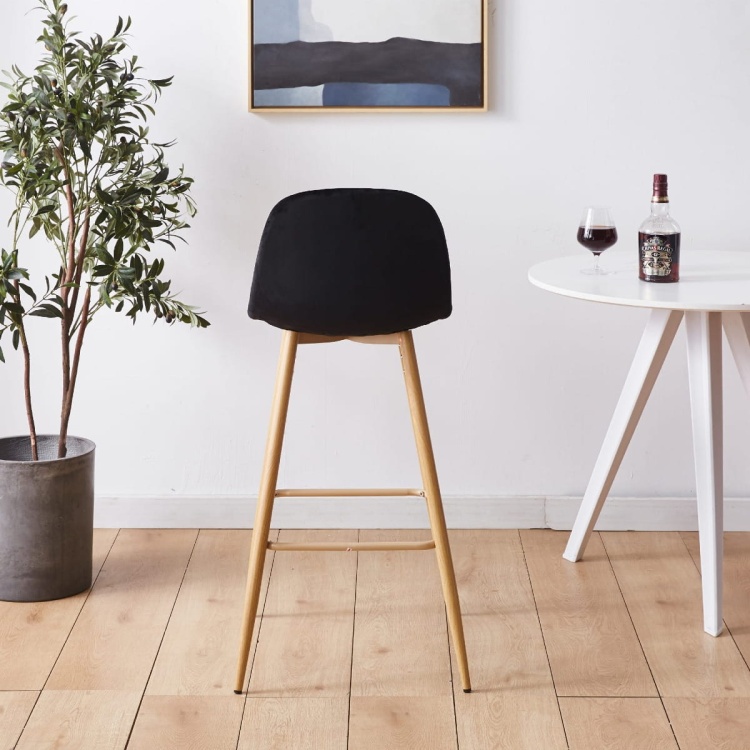 Hoker tapicerowany Nilson czarny, nogi motyw drewno 75 cm